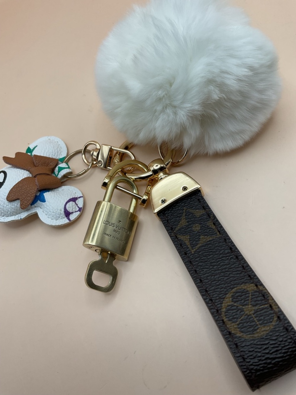 Monogram Leather Strap Keychain with Louis Vuitton Gold Lock and White Pom Pom - Picture 2 of 5